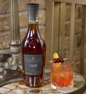 Caus Bottle VSOP Elegane Botlle and Old fashioned Cocktail on marble table low res.jpg